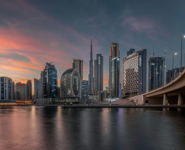 pexels-photo-13398520-13398520 Captivating view of Dubai's modern skyline featuring Burj Khalifa during a vibrant sunset.