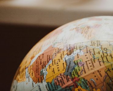 pexels-photo-335393-335393 Detailed close-up of a globe showcasing parts of Europe and Asia for world exploration concepts.